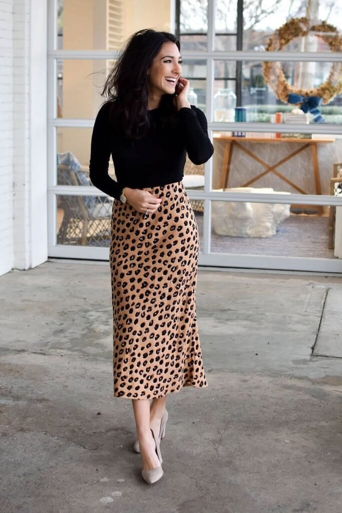 Black Long-Sleeve Bodysuit + Leopard Print Midi Skirt + Beige Suede Pumps