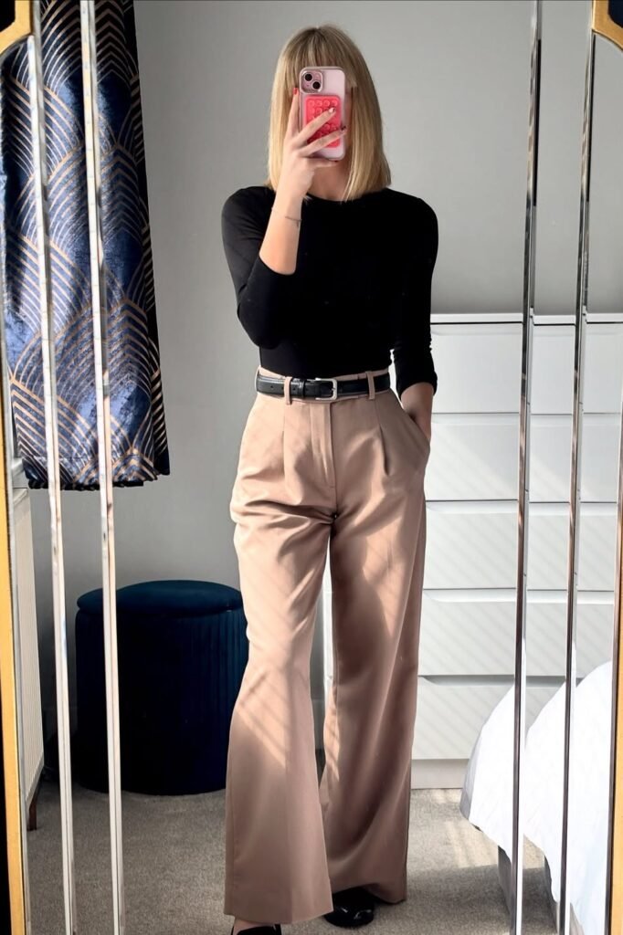 Black Long-Sleeve Bodysuit + Tan Pleated Wide-Leg Trousers + Black Belt