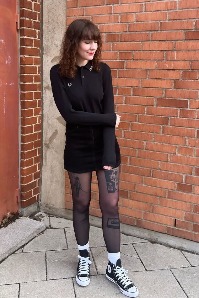 Black Long-Sleeve Polo + Black Denim Mini Skirt + Graphic Sheer Tights + Black High-Top Sneakers