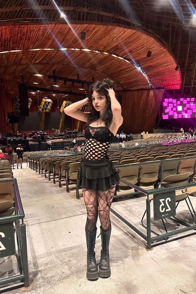 Black Mesh Cut-out Bodysuit + Black Tiered Mini Skirt + Distressed Fishnet Tights + Black Platform Combat Boots