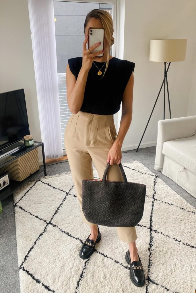 Black Muscle Tee with Shoulder Pads + Tan High-Waisted Tapered Trousers + Black Chunky Loafers