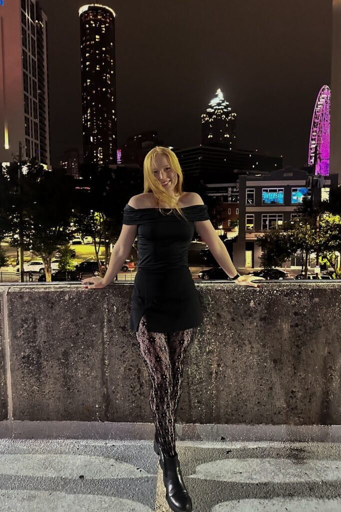 Black Off-the-Shoulder Top + Black Mini Skirt + Patterned Lace Tights & Black Chelsea Boots