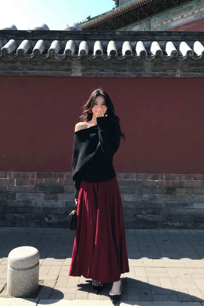 Black Off-the-shoulder Sweater + Dark Red Pleated Maxi Skirt + Black Pointed-toe Studded Flats