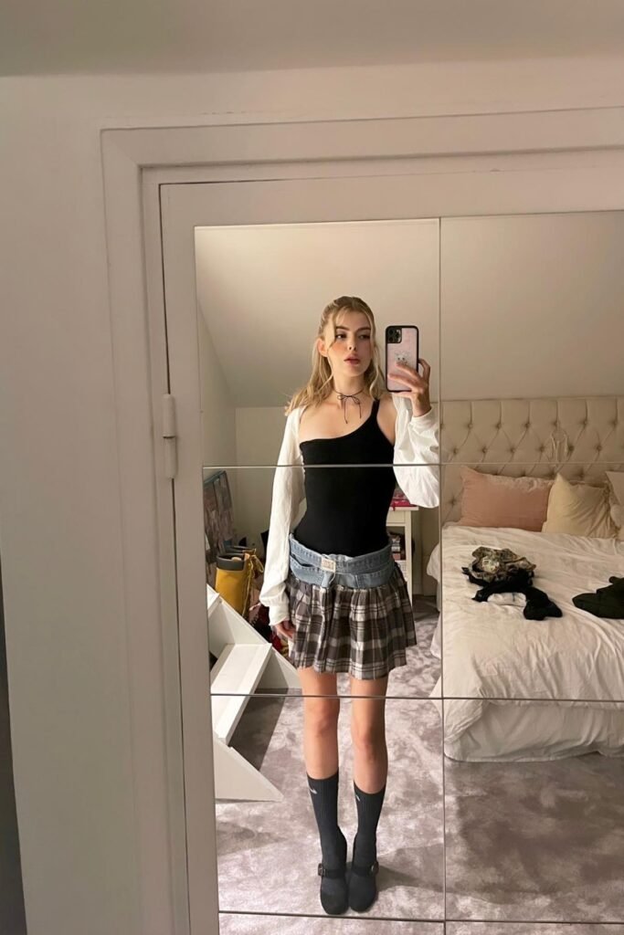 Black One-Shoulder Bodysuit + Grey Plaid Mini Skirt + White Shrug + Black Mary Janes