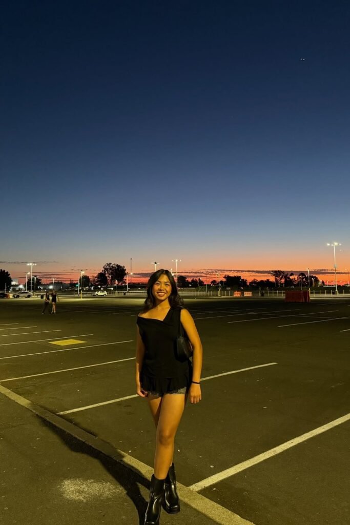 Black One-Shoulder Ruffle Top + Denim Shorts + Black Square-Toe Boots