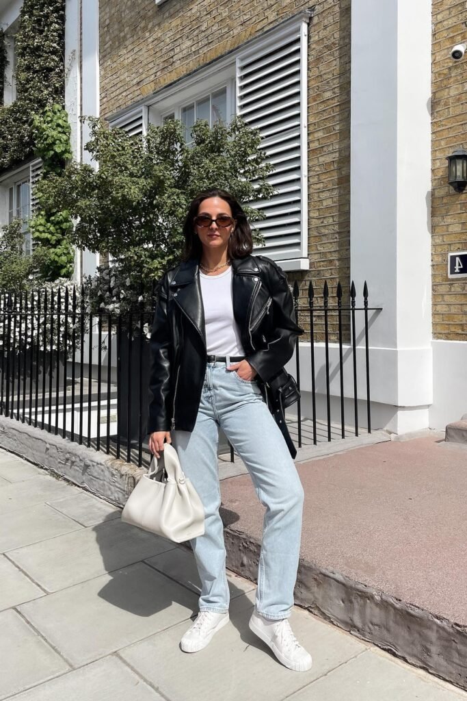 Black Oversized Biker Jacket + White Ribbed Tank Top + Light Wash Straight-Leg Jeans + White Low-Top Sneakers