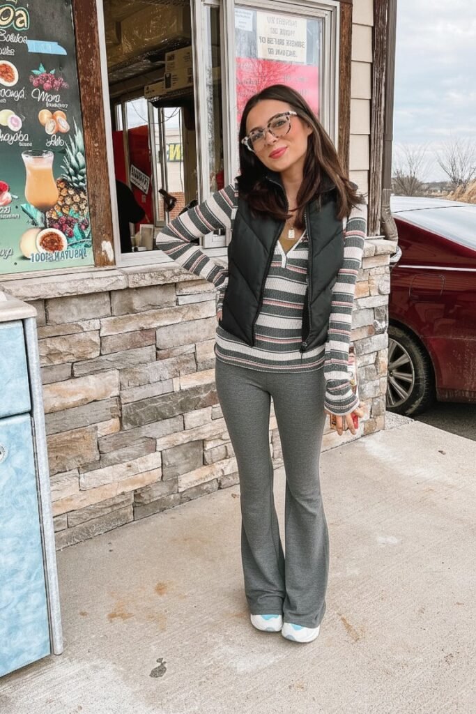 Black Puffer Vest + Striped Long-Sleeve Shirt + Grey Flared Leggings + White Sneakers