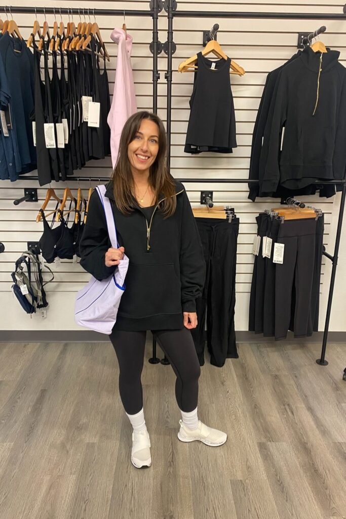 Black Quarter-Zip Pullover + Black Leggings + White Athletic Sneakers