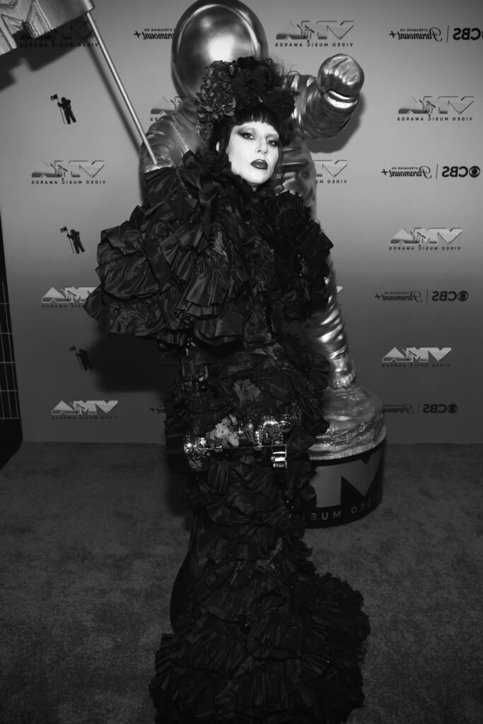 Black Ruffled Avant-Garde Gown + Matching Floral Headpiece + Black Lace Gloves