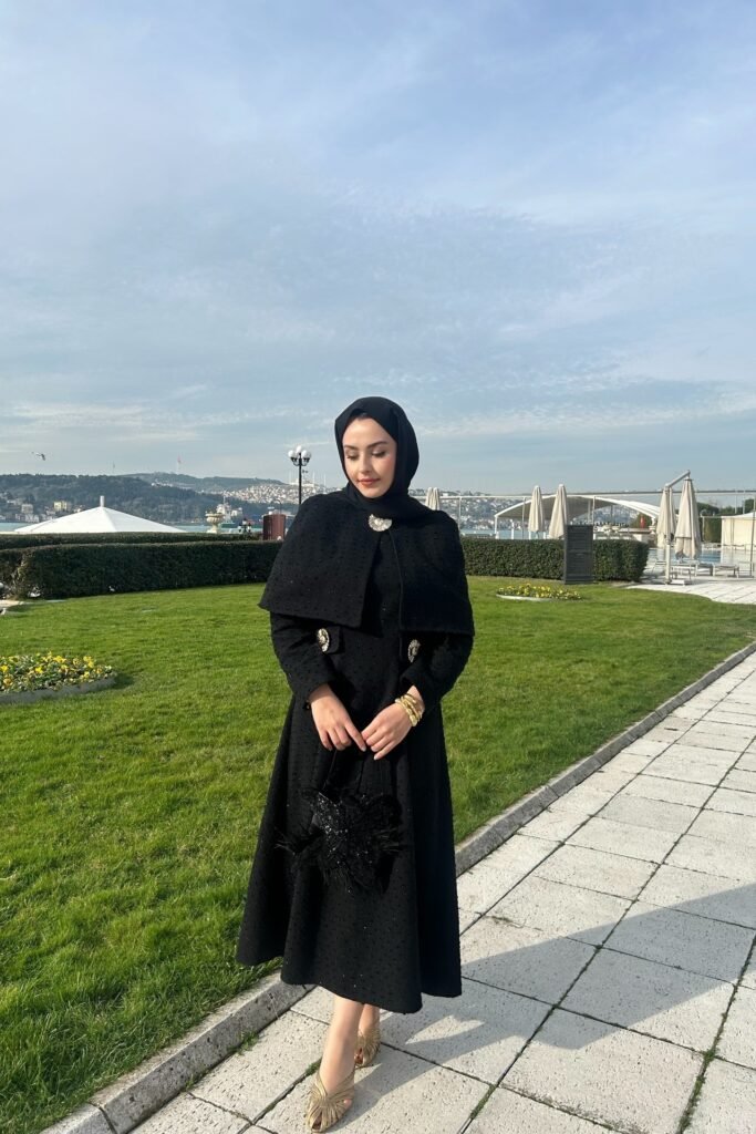 Black Textured Cape Dress + Black Hijab + Gold Embellished Heels