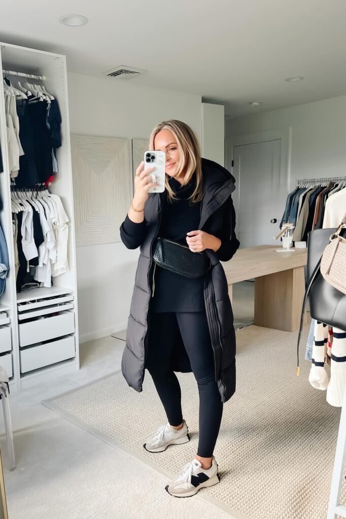 Black Turtleneck Top + Long Black Puffer Vest + Black Leggings + Off-White Athletic Sneakers