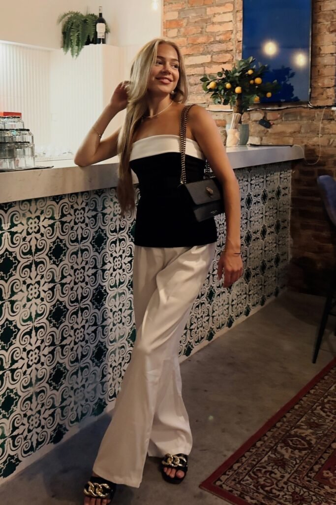 Black & White Strapless Top + White Wide-Leg Trousers + Black Chain Slides