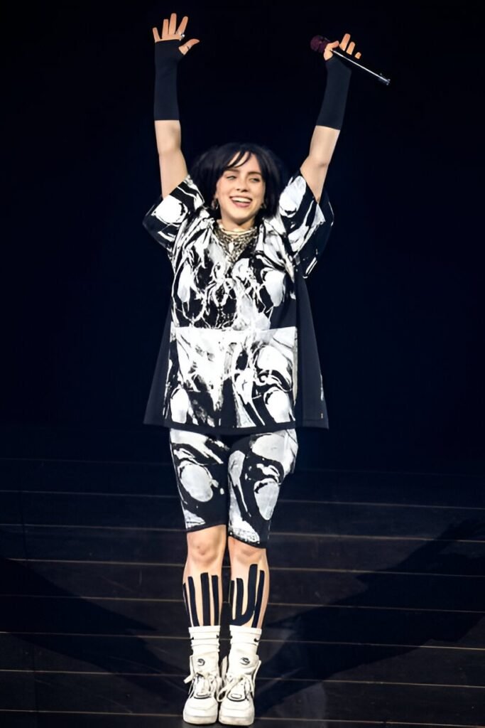 Black and White Marble Print Oversized Tee + Matching Biker Shorts + Black Arm Sleeves + White High-Top Sneakers