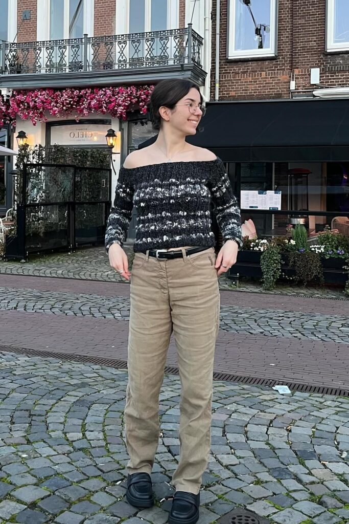 Black and White Textured Off-the-Shoulder Sweater + Khaki Straight-Leg Trousers + Black Loafers