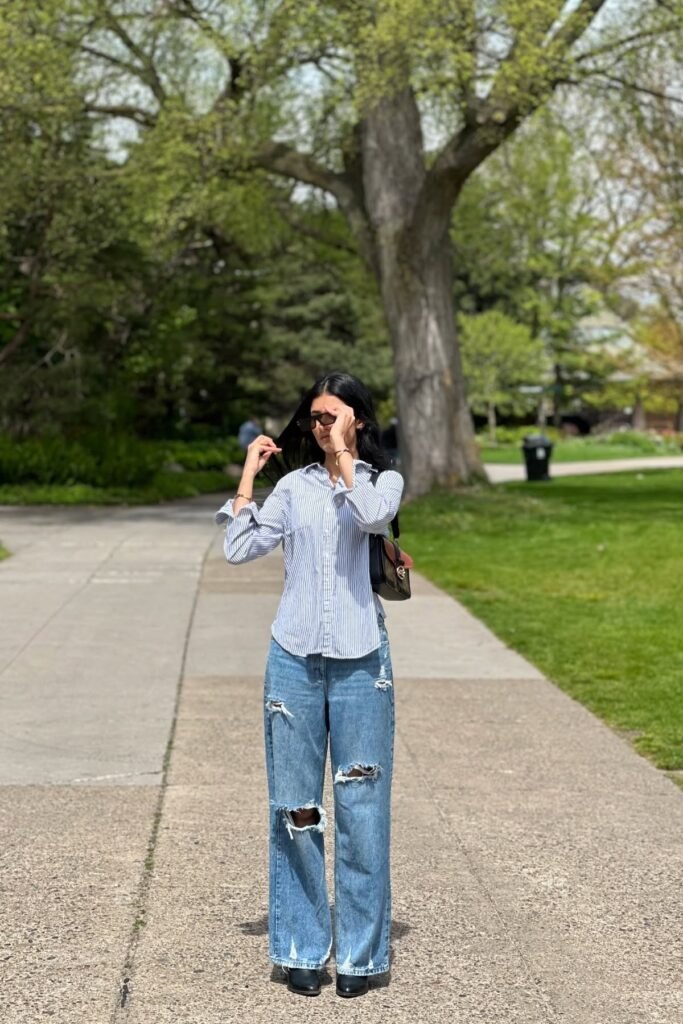 Blue and White Striped Button-Down Shirt + Light Wash Distressed Wide-Leg Jeans + Black Square-Toe Boots