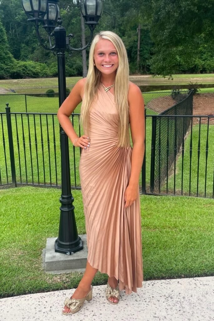 Bronze One-Shoulder Pleated Midi Dress + Gold Bow Mules + Gold Statement Necklace