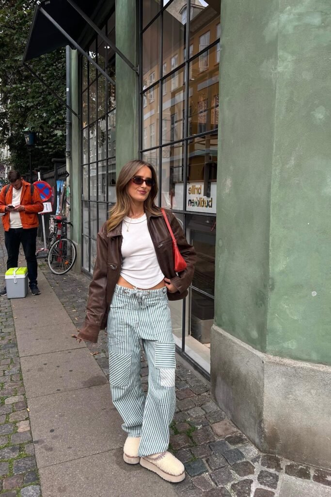Brown Leather Jacket + White Ribbed Top + Green and White Striped Cargo Pants + Beige Platform Slippers