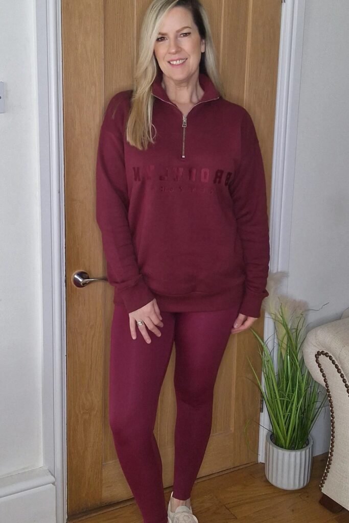 Burgundy Quarter-Zip Sweatshirt + Burgundy Leggings + White Sneakers