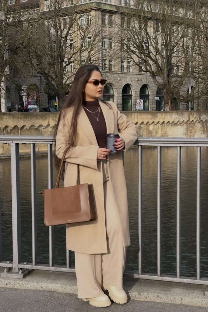 Camel Overcoat + Brown Mock-Neck Top + Beige Wide-Leg Trousers + Cream Chunky Boots