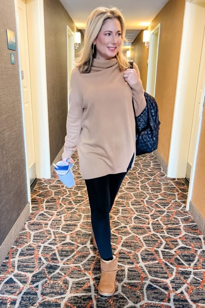 Camel Turtleneck Tunic Sweater + Black Leggings + Tan Shearling-Lined Boots