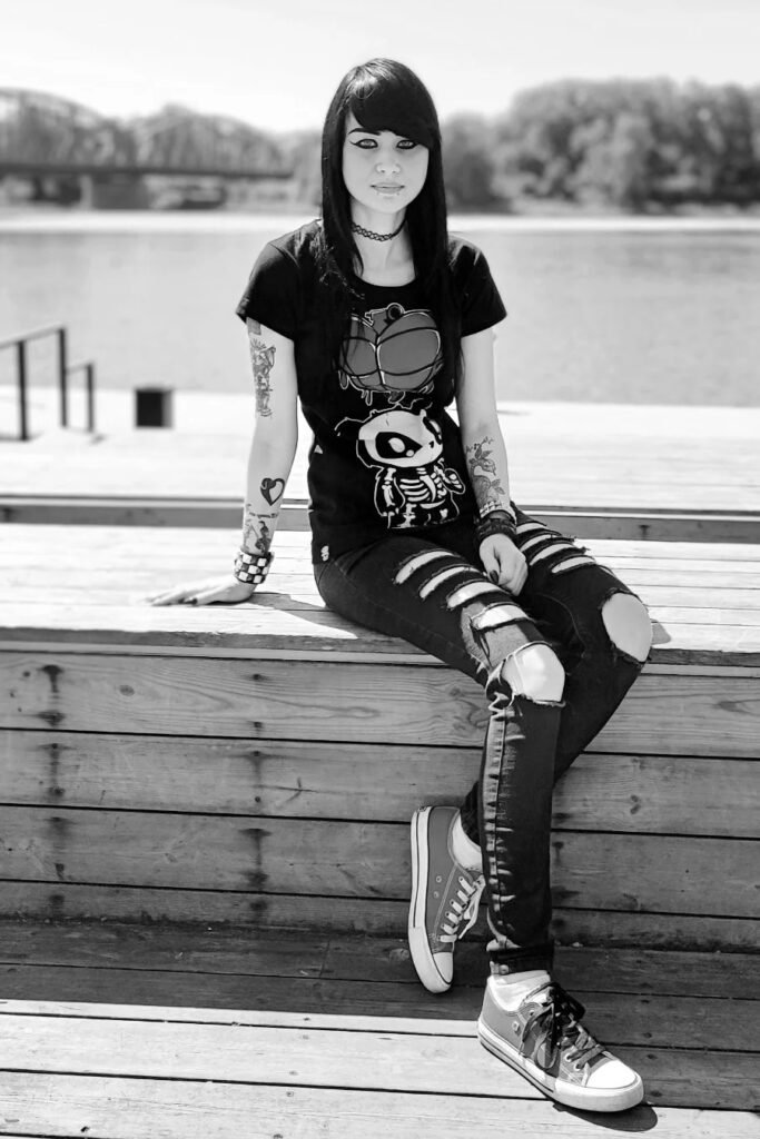 Cartoon Graphic T-Shirt + Black Ripped Skinny Jeans + Red Low-Top Sneakers