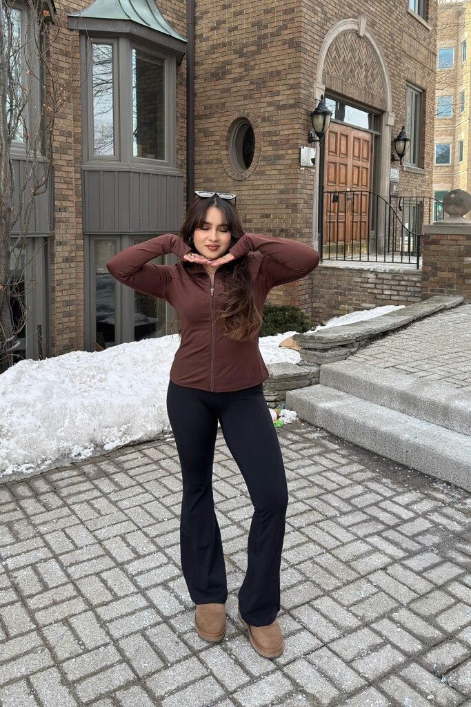 Chocolate Brown Zip-Up Performance Jacket + Black Flared Leggings + Brown Shearling Boots