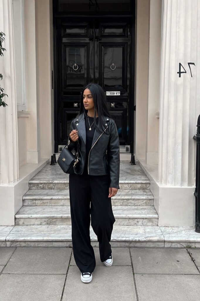 Classic Black Leather Biker Jacket + Black High-Waisted Wide Leg Trousers + Black and White Canvas Sneakers