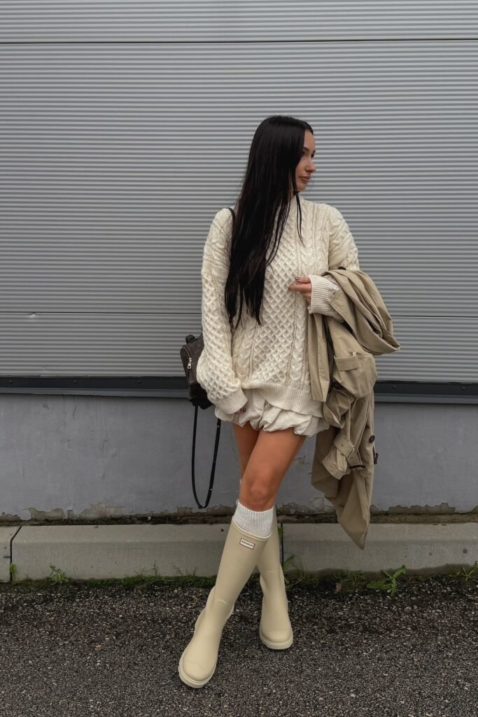 Cream Cable-Knit Oversized Sweater + Cream Puffy Mini Skirt + Cream Knee-High Rain Boots