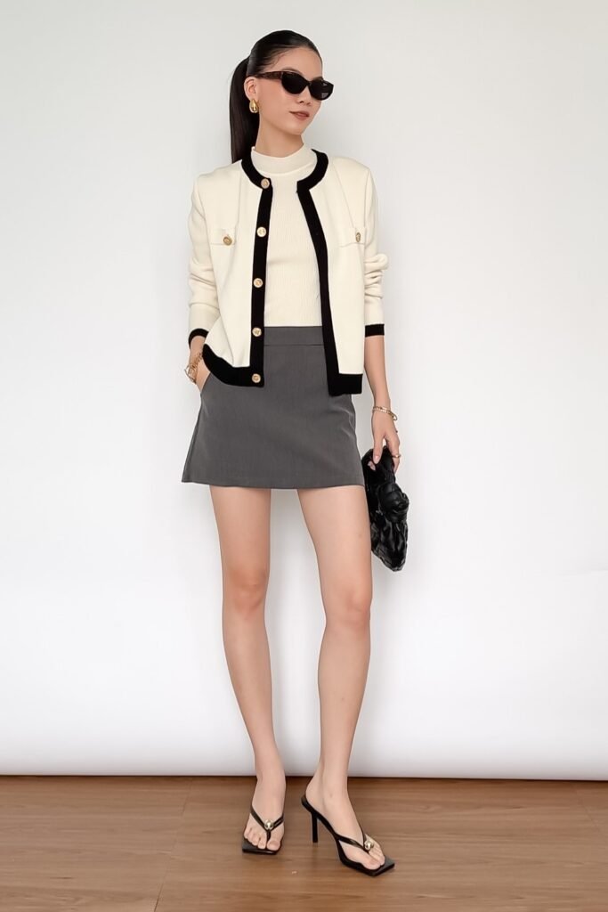 Cream Contrast-Trim Cardigan + White Mock-Neck Top + Grey Mini Skirt + Black Thong Mules