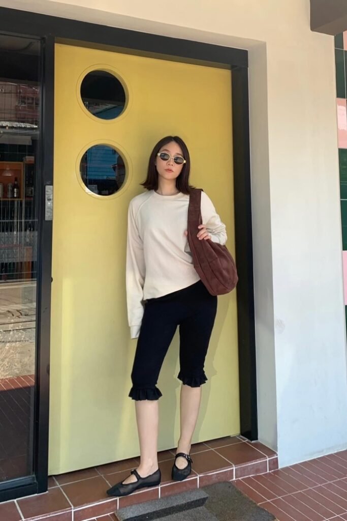 Cream Crewneck Sweatshirt + Black Ruffle-Hem Capri Leggings + Black Mary Jane Flats