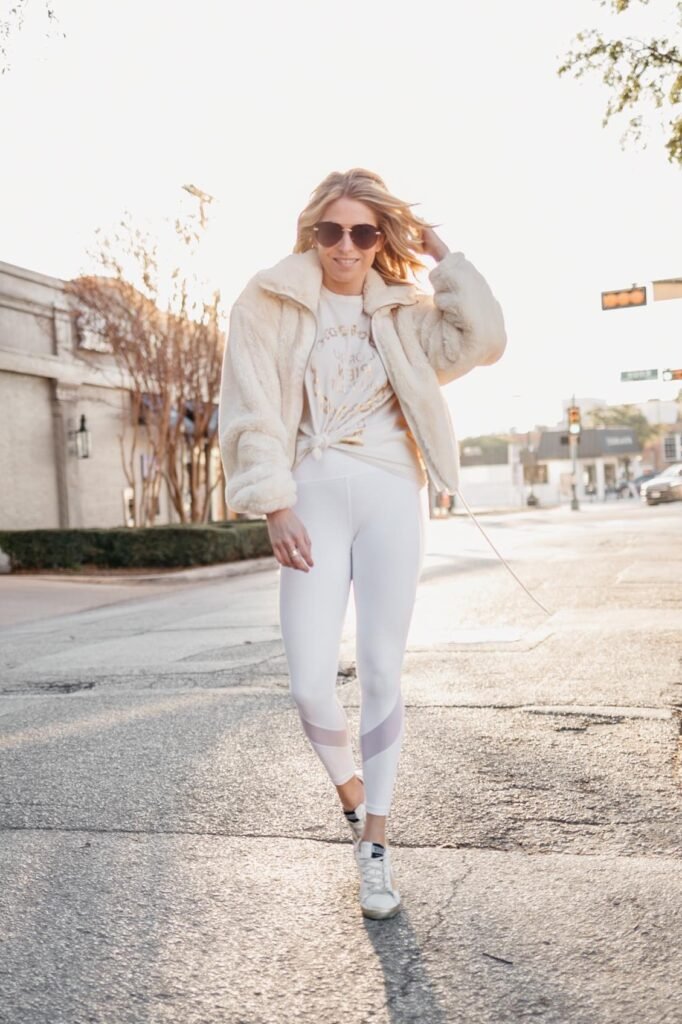 Cream Faux-Fur Bomber Jacket + White Graphic Tee + White Mesh-Panel Leggings + White Sneakers