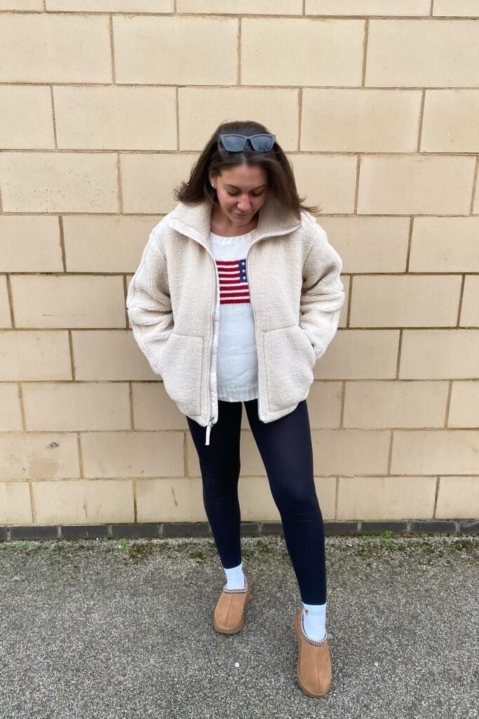 Cream Fleece Zip-Up Jacket over Flag Sweater + Black Leggings + Tan Mules with White Socks