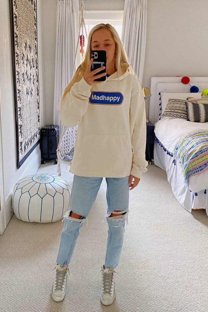 Cream Graphic Hoodie + Ripped Light-Wash Jeans + Distressed High-Top Sneakers