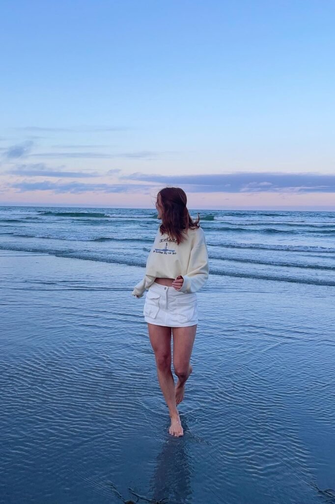 Cream Graphic Sweatshirt + White Cargo Mini Skirt + Barefoot