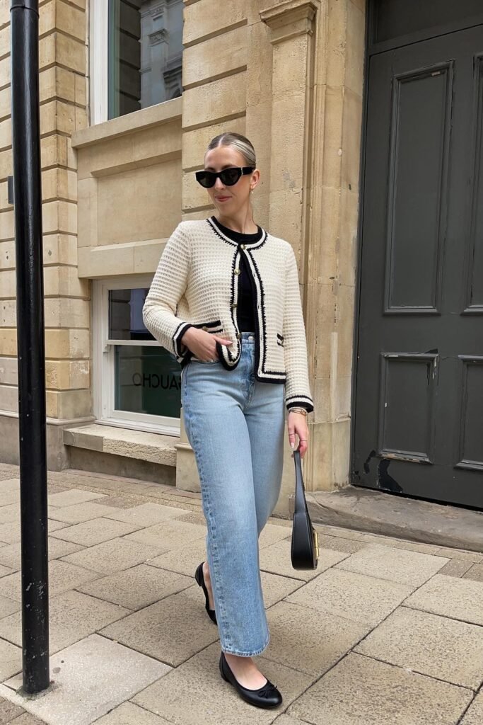 Cream Knit Cardigan with Black Contrast Trim + Light Wash Straight-Leg Jeans + Black Ballet Flats