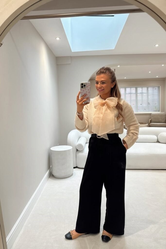 Cream Knit Sweater with Oversized Sheer Bow + Black Wide-Leg Trousers + Two-Tone Ballet Flats