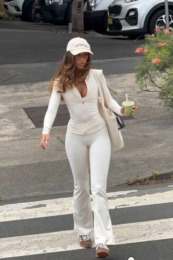 Cream Long-Sleeve Zip-Up Top + White High-Waisted Flared Yoga Pants + Brown Sneakers