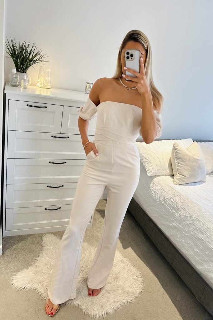 Cream Off-The-Shoulder Jumpsuit + Gold Dainty Jewelry + Clear Heeled Sandals