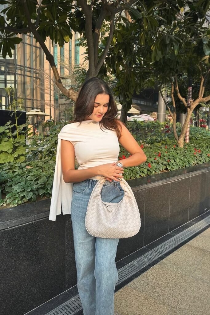 Cream One-Shoulder Drape Top + Light Wash Straight Jeans + Off-White Woven Tote Bag