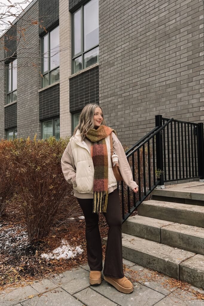 Cream Puffer Vest + Beige Oversized Sweatshirt + Brown Flared Leggings + Tan Platform Boots