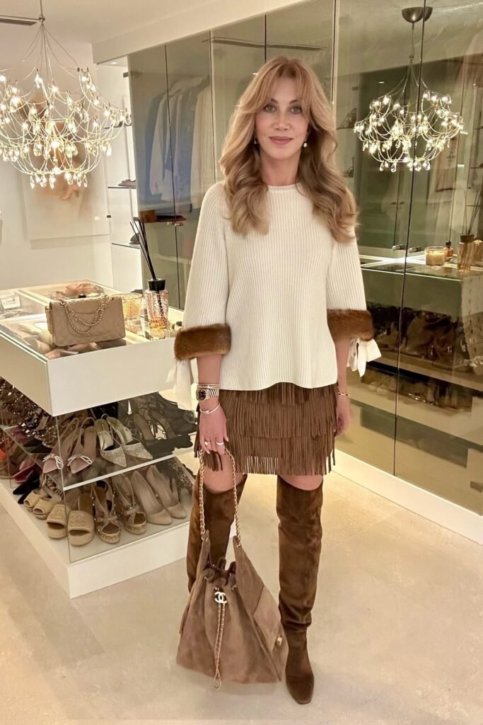 Cream Ribbed Sweater with Fur Cuffs + Brown Fringe Mini Skirt + Brown Over-the-Knee Suede Boots