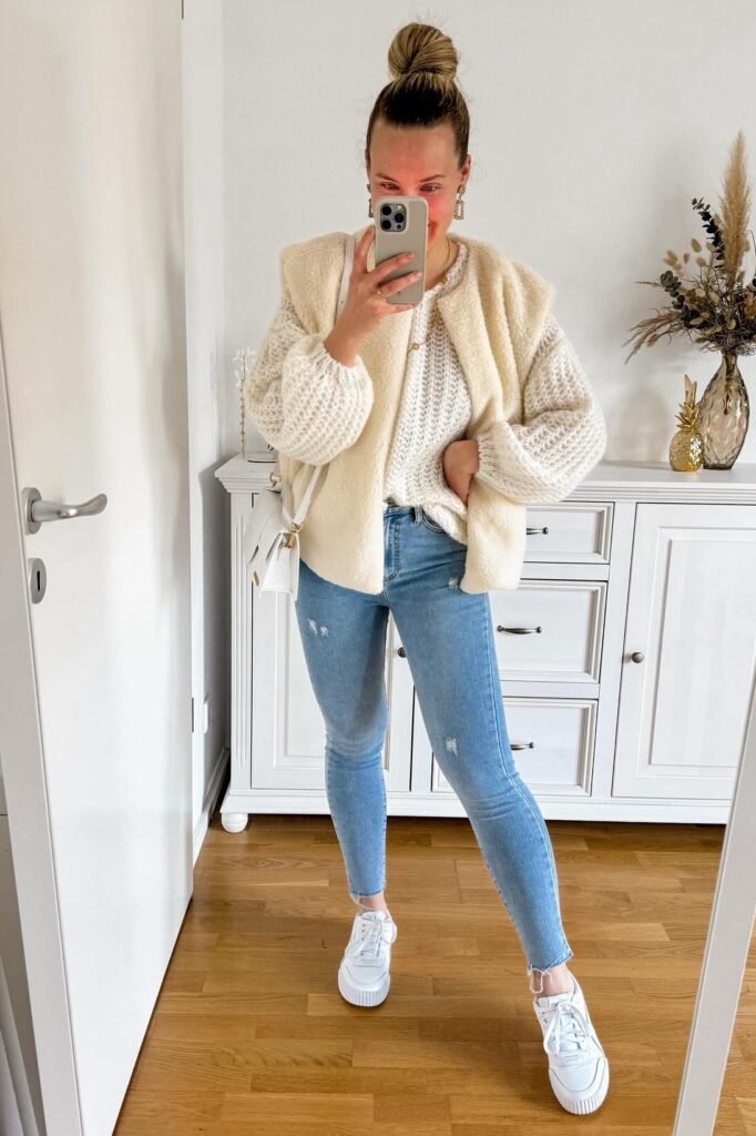 Cream Shearling Vest + White Pointelle Sweater + Light Blue Distressed Skinny Jeans + White Platform Sneakers
