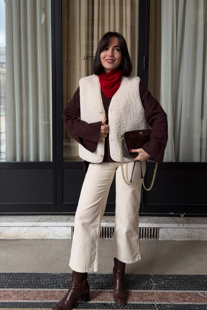 Cream Sherpa Vest + Dark Brown Oversized Shirt + Off-White Wide-Leg Jeans + Brown Leather Boots
