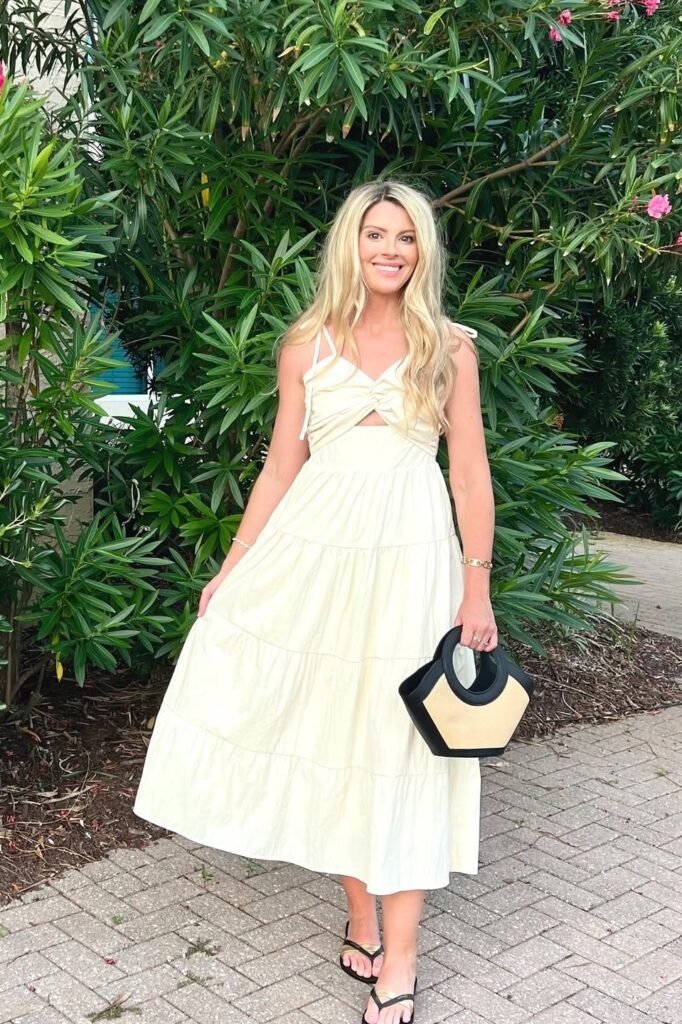 Cream Tiered Halter Maxi Dress + Black Flip-Flops + Straw Bucket Bag