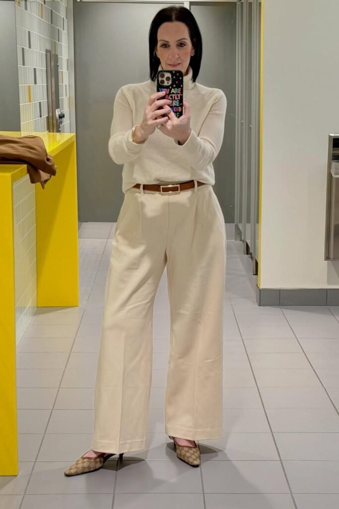 Cream Turtleneck Sweater + Beige Tucked Trousers + Patterned Pointed Mules