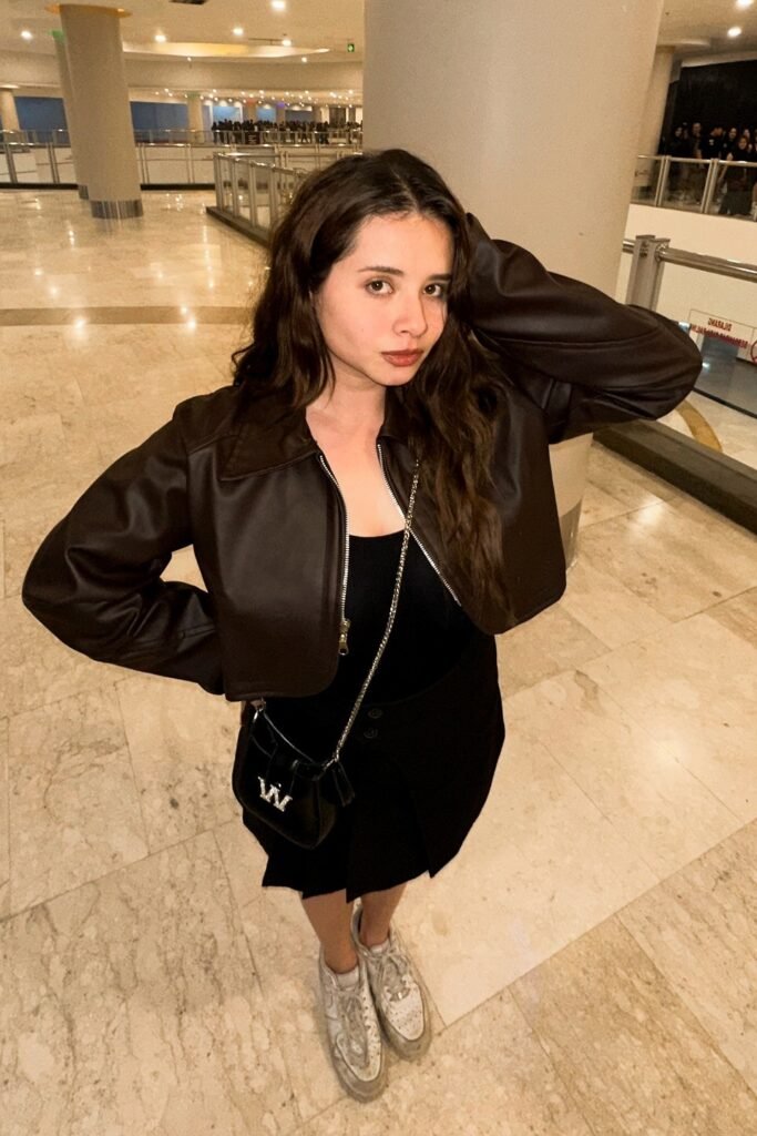 Cropped Brown Leather Jacket + Black Top & Skirt + White Distressed Sneakers