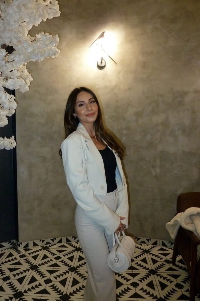 Cropped White Blazer + Black Bodysuit + High-Waisted White Trousers + White Barrel Bag