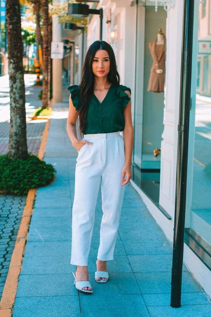 Dark Green Ruffle-Sleeve Blouse + White High-Waisted Trousers + White Quilted Heeled Sandals
