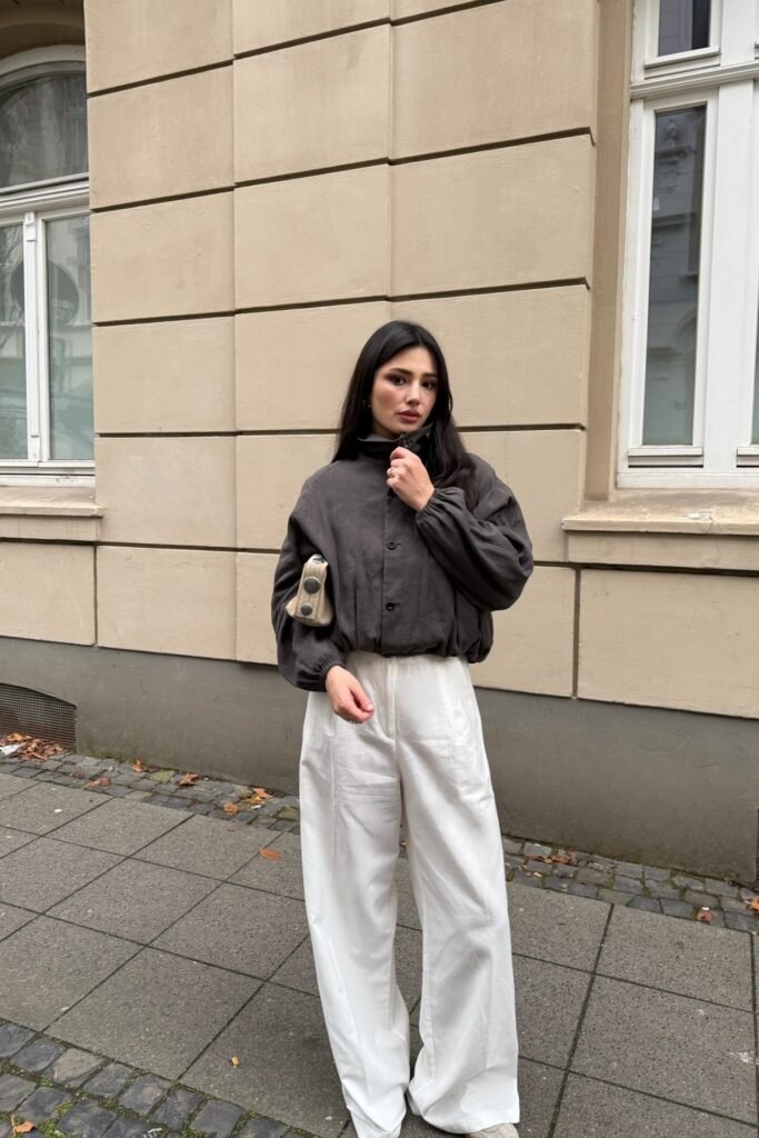 Dark Grey Mock-Neck Bomber Jacket + White High-Waisted Wide-Leg Trousers + White Sneakers