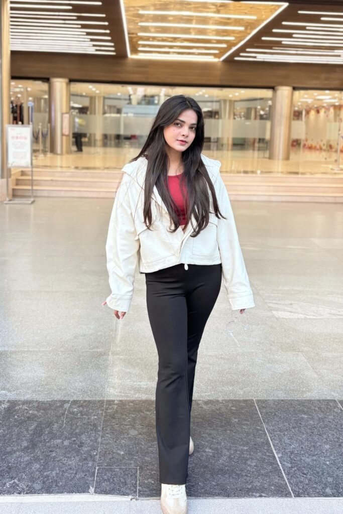 Dark Red Crop Top + White Zip-up Hooded Jacket + Black Flare Leggings + White and Beige Sneakers